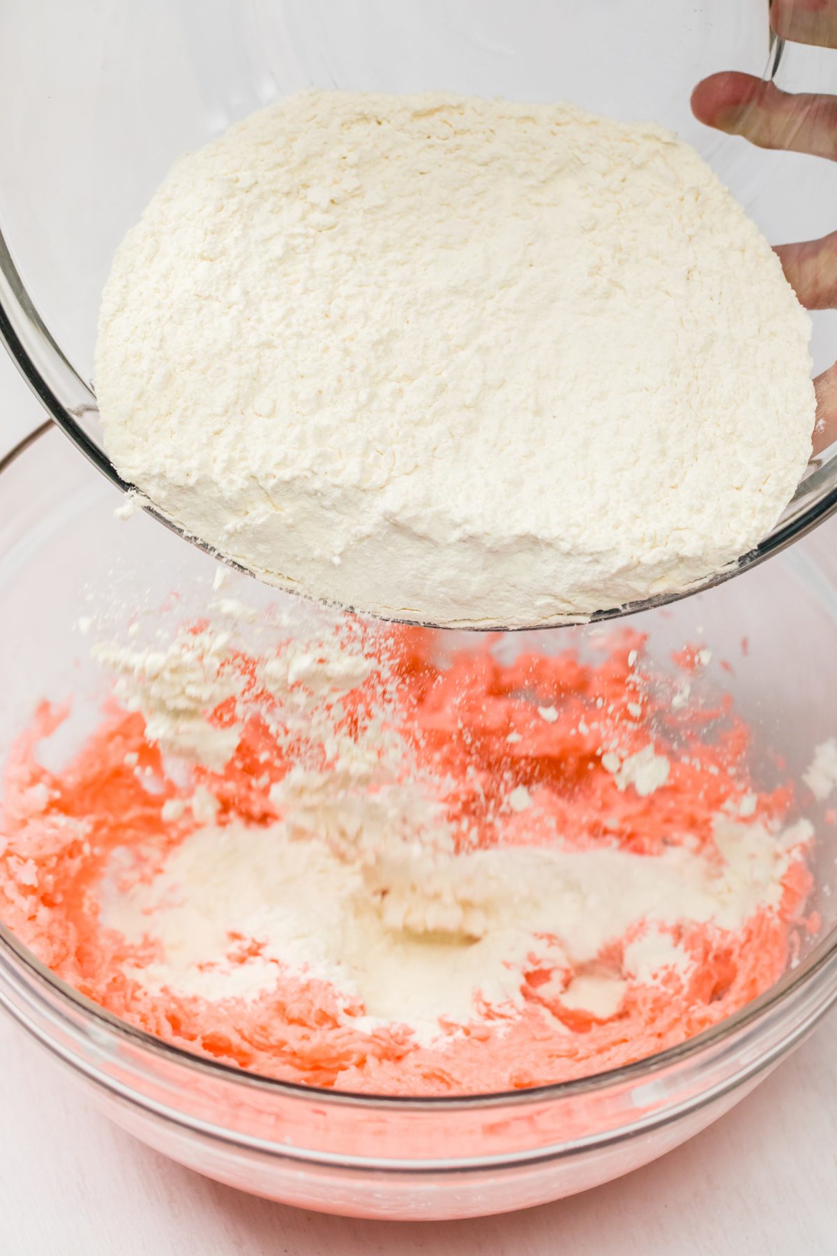Adding flour to cranberry cookie batter