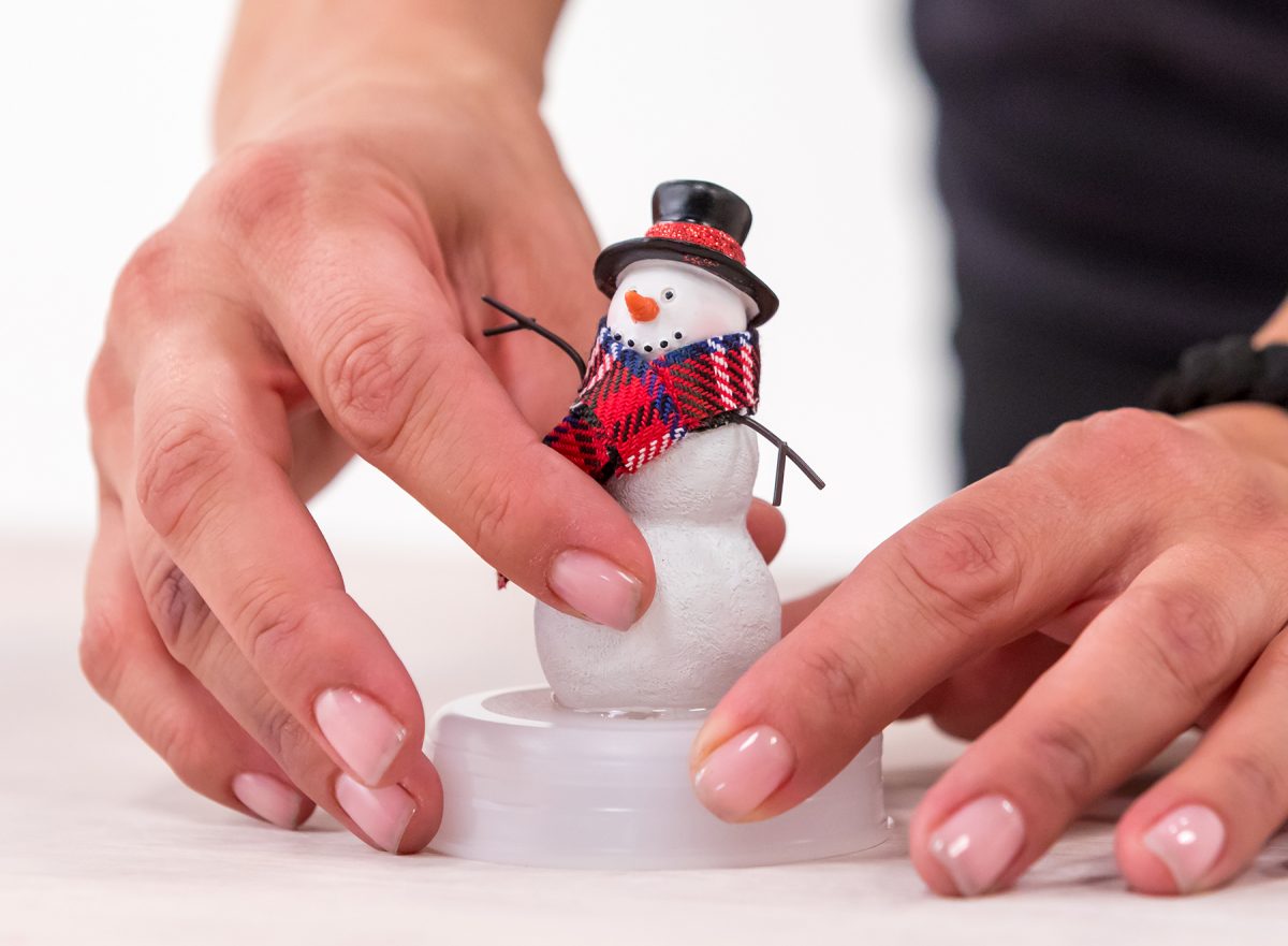 Snowman on homemade snow globe