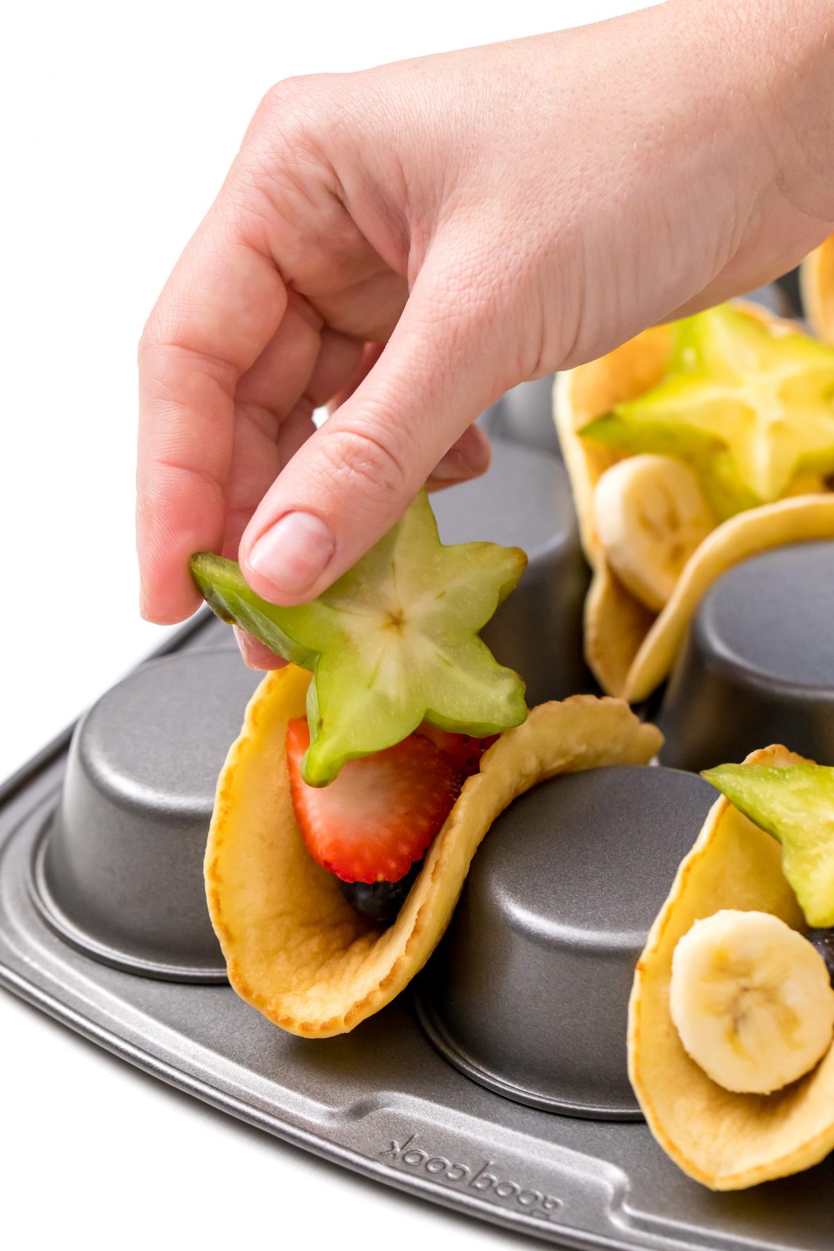 Place bananas and starfruit inside of pancake taco