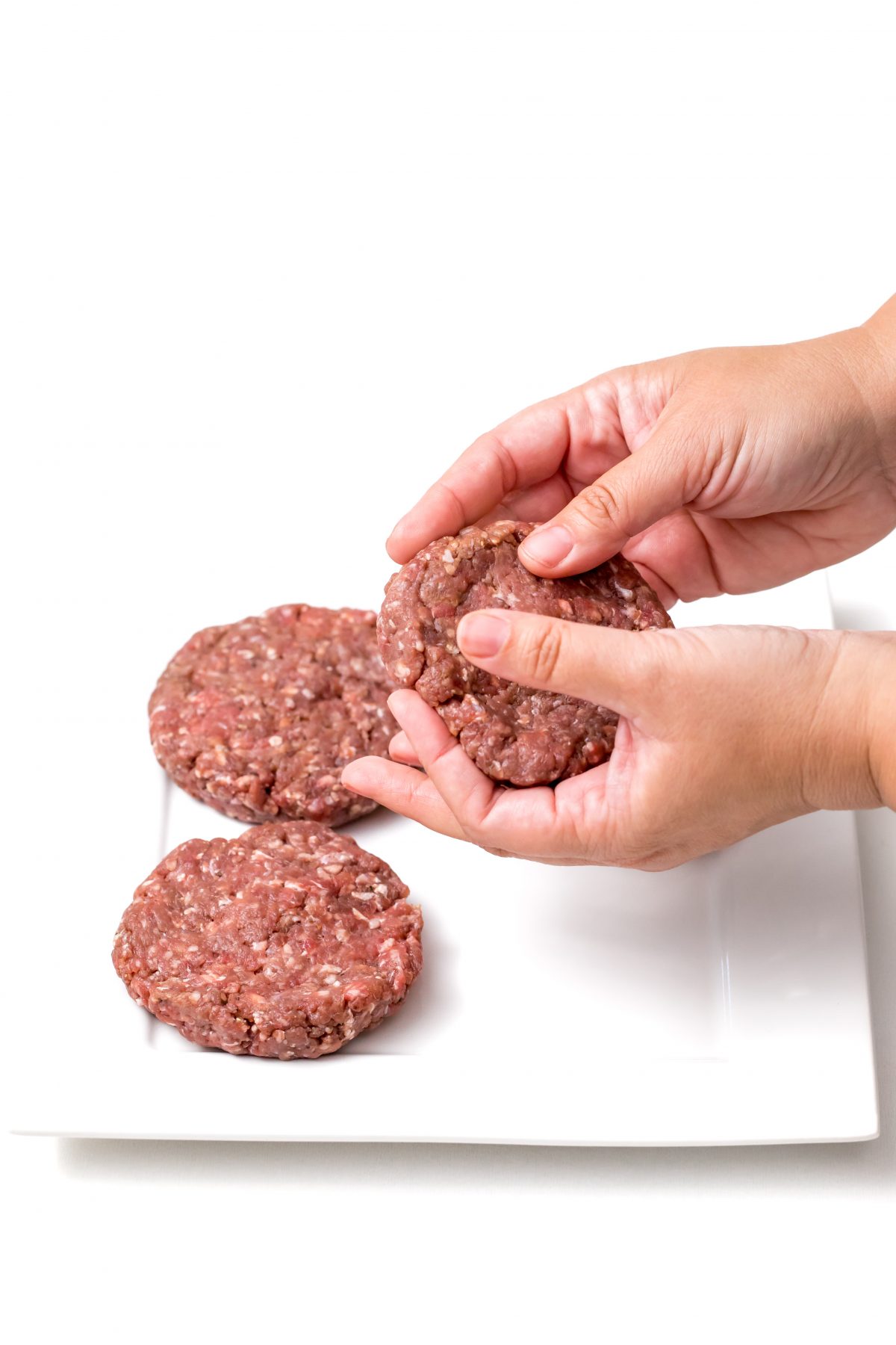 Oven baked burgers making burger patties from raw meat