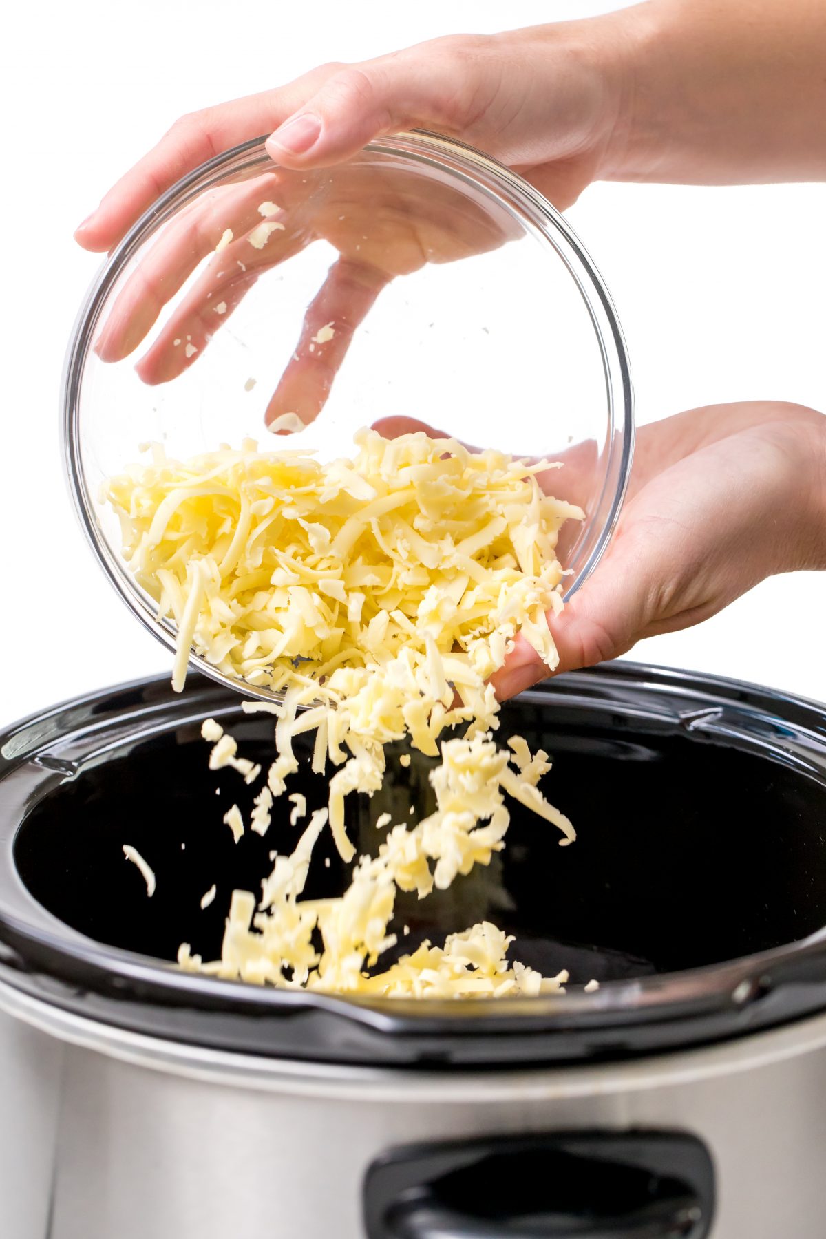 Pour cheese into slow-cooker