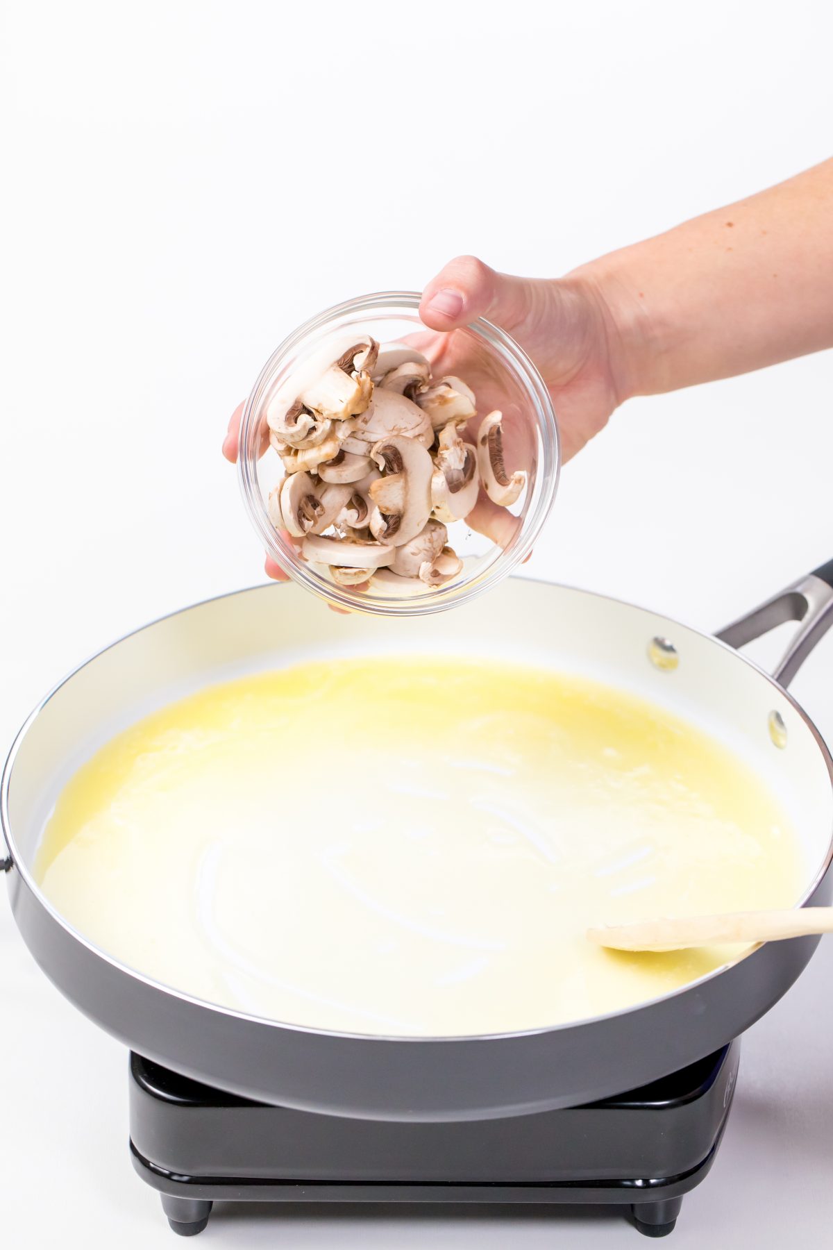 Add mushrooms to melted butter
