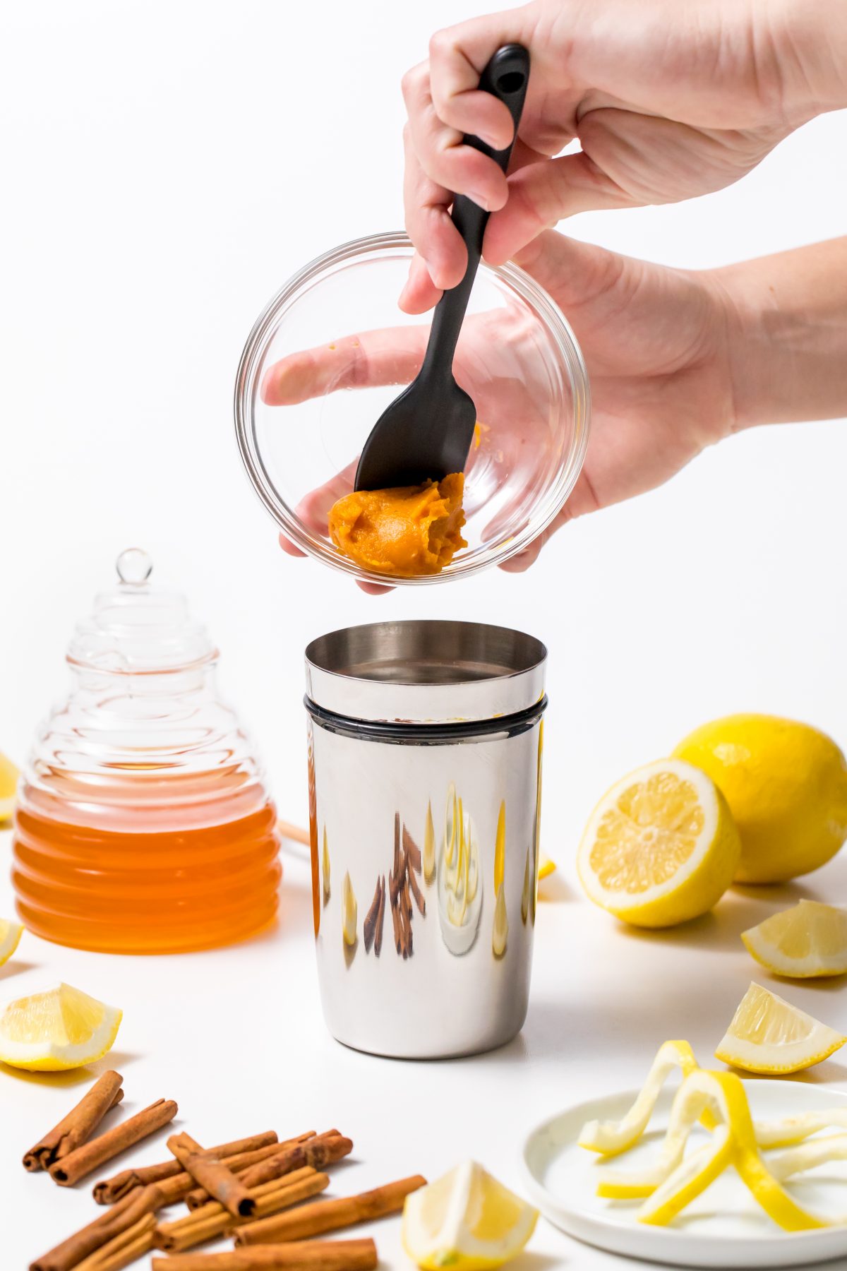 Combine pumpkin puree, honey, and lemon juice in a shaker