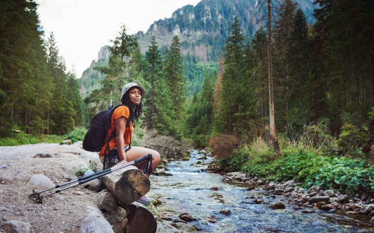 Ways to practice self-care in the New Year woman hiking