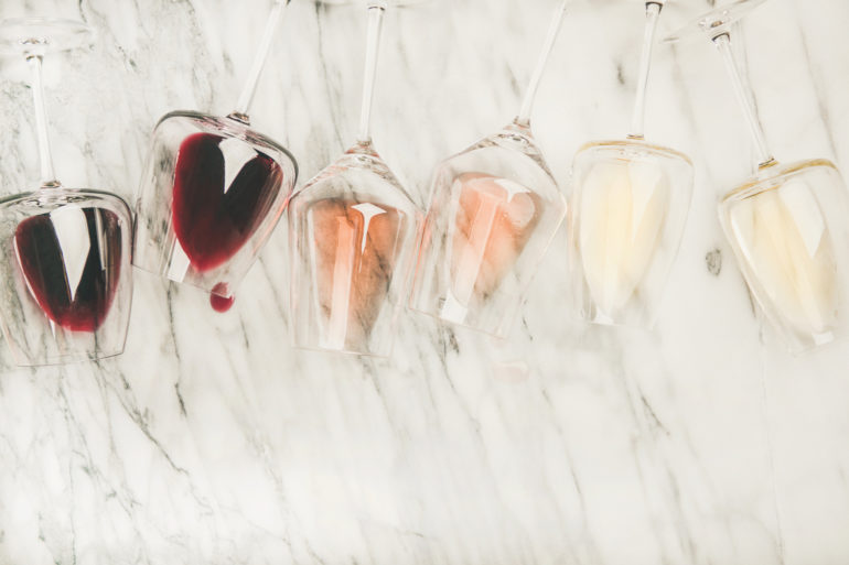 Red, rose, white wine in glasses and corkscrews