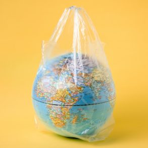 globe model in plastic bag, save the world environment